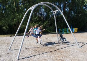Children playing on playground swing